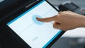 Close Up Shot of a Person Touching an Electronic Fingerprint Recognition Feature on a Digital Screen