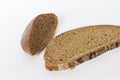 Close up shot of pieces of brown bread on white background. Food Royalty Free Stock Photo