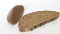 Close up shot of pieces of brown bread on white background. Food Royalty Free Stock Photo