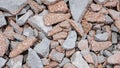 Close up shot of pile of broken red bricks background