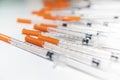 Close Up Shot Of A Pile Of Medical Insulin Needles With Orange Caps Royalty Free Stock Photo
