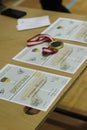 Close-up shot of ping pong blank diplomas on a wooden table