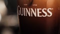 Close up shot of a pint of Guinness in a glass in a bar Royalty Free Stock Photo