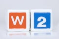 Two plastic blocks with W2 tax form text