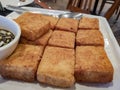 Close up shot of a plate of deep fried tofu