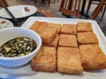 Close up shot of a plate of deep fried tofu