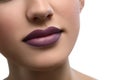 Close up shot of plump female lips covered with lipstick