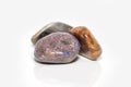 Three polished colorful rocks on white background Royalty Free Stock Photo