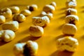 Close up shot of Popcorn arranged in a neat on the yellow background Royalty Free Stock Photo