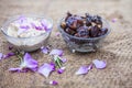 Close up shot of popular Indian & Asian Khajor dudh or dates milk in a transparent glass bowl along with raw dates and some cut in