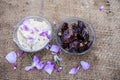 Close up shot of popular Indian & Asian winter dessert in a transparent glass bowl i.e. Khajor ka halwa or dates confection with r