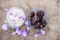 Close up shot of popular Indian & Asian winter dessert in a transparent glass bowl i.e. Khajor ka halwa or dates confection with r