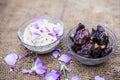 Close up shot of popular Indian & Asian winter dessert in a transparent glass bowl i.e. Khajor ka halwa or dates confection with r