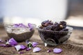 Close up shot of popular Indian & Asian winter dessert in a transparent glass bowl i.e. Khajor ka halwa or dates confection with r