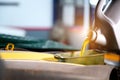 Close-up shot of pouring oil into the engine compartment Auto mechanic in car repair shop is pouring golden yellow engine oil in Royalty Free Stock Photo