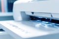 A close-up shot of a printer sitting on a desk, ready for use Royalty Free Stock Photo