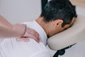 close-up shot of professional masseuse doing seated massage