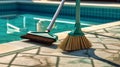 A close-up shot of professional pool cleaning tool, pool brush, neatly arranged by the side of the pool, emphasizing the