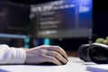 Close up shot of programmer installing fortified code on PC, using mouse