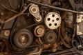 Close up shot of the pulley system and drive belt on a powerful diesel or gasoline used engine with parts of the car and vehicles Royalty Free Stock Photo