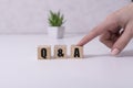 Close-up Shot of Q and A wooden blocks. Royalty Free Stock Photo