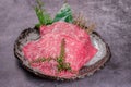 Close-up shot of raw marble meat slices on a plate Royalty Free Stock Photo