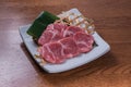 Close-up shot of raw marble meat slices on a plate Royalty Free Stock Photo