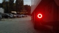 Close-up shot of the rear round red marker light of a truck. Rear light for a truck. The background is blurred. The concept of Royalty Free Stock Photo