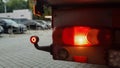 Close-up shot of the rear round red marker light of a truck. Rear light for a truck. The background is blurred. The concept of Royalty Free Stock Photo