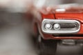 Close up shot of red collectible toy car head lamps Royalty Free Stock Photo