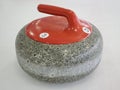 Close up shot of a red curling stone Royalty Free Stock Photo