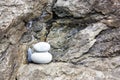 Close-up shot of rocky hillside with balancing stones in Cinqueterre, Italy