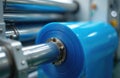 Close-up shot roller of polyethylene bag production machine. Process of automatic cellophane packaging, packing in modern Royalty Free Stock Photo
