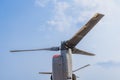 Rotors of a Boeing CV-22 Osprey Aircraft pointed up against a blue sky