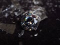 Close up shot of roud cut zircon zirconia gems with broken glass surrounded Royalty Free Stock Photo