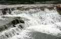 Close up shot of a rushing stream in forest creek