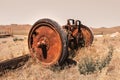 Rusty wheels on old farm equipment in the middle of prairies Royalty Free Stock Photo