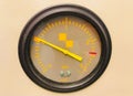 Close-up shot of a scientific pressure gauge instrument with a yellow indicator in the laboratory