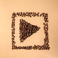 Close-up shot of scoop and roasted coffee beans spilled Royalty Free Stock Photo