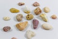 Close-up shot of several colorful stones that collected from beach on white background Royalty Free Stock Photo