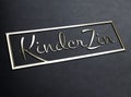 Elegant silver script text kinder zin on a rectangular black plate isolated on white background Royalty Free Stock Photo