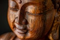 Close Up of a Wooden Statue of a Buddha Royalty Free Stock Photo