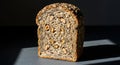 Delicious Slice of Walnut and Seed Bread Illuminated by Natural Sunlight Royalty Free Stock Photo