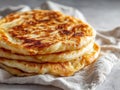 Golden Brown Stacked Flatbreads With Crispy Edges On Textured Gray Surface With White Cloth Royalty Free Stock Photo
