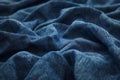 Close-up of blue denim texture with soft folds. Royalty Free Stock Photo