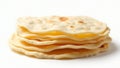 A stack of flatbreads or tortillas on a white surface with some browning spots on the top layer Royalty Free Stock Photo