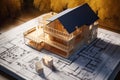 A close-up shot shows a mock-up of a future villa made of wood and paper on a construction drawing, highlighting the