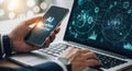 Modern technology integration person using smartphone and laptop with ai and data visualizations Royalty Free Stock Photo