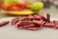 Sliced domestic ham on a kitchen table.