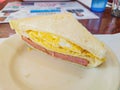 Close up shot of a sliced ham and egg sandwich Royalty Free Stock Photo